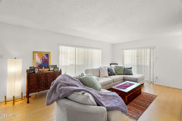 a living room with furniture and a large window