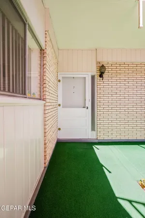 a view of a parking space and garage