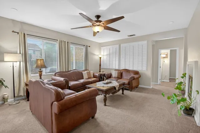 a kitchen with granite countertop a sink stove and refrigerator