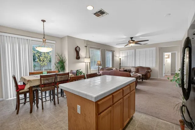 a bathroom with a sink toilet a mirror and shower