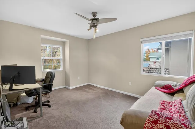 a view of a house with backyard porch and sitting area
