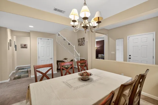 a bedroom with furniture and a wooden floor