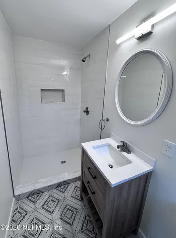 a view of a room with a wooden door