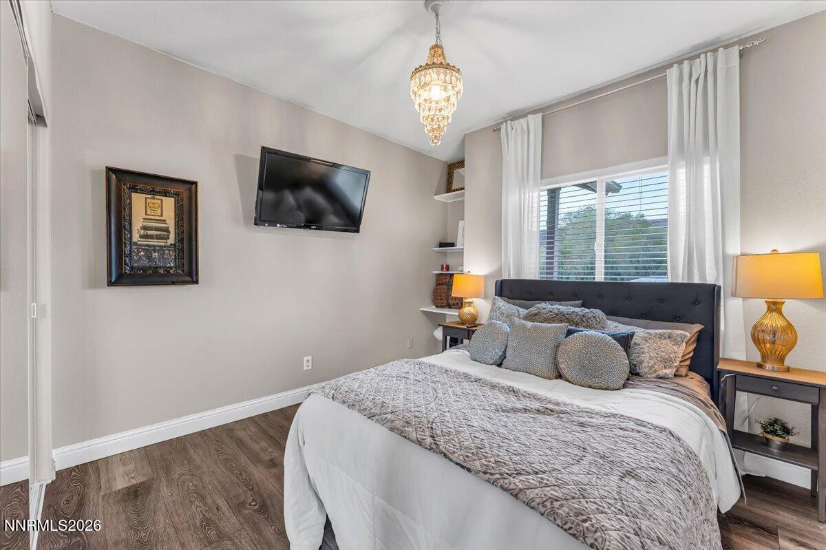 15770 Rocky Vista Road Reno, NV 89521 - Photo 22 of 68 a bedroom with a bed and a flat screen tv