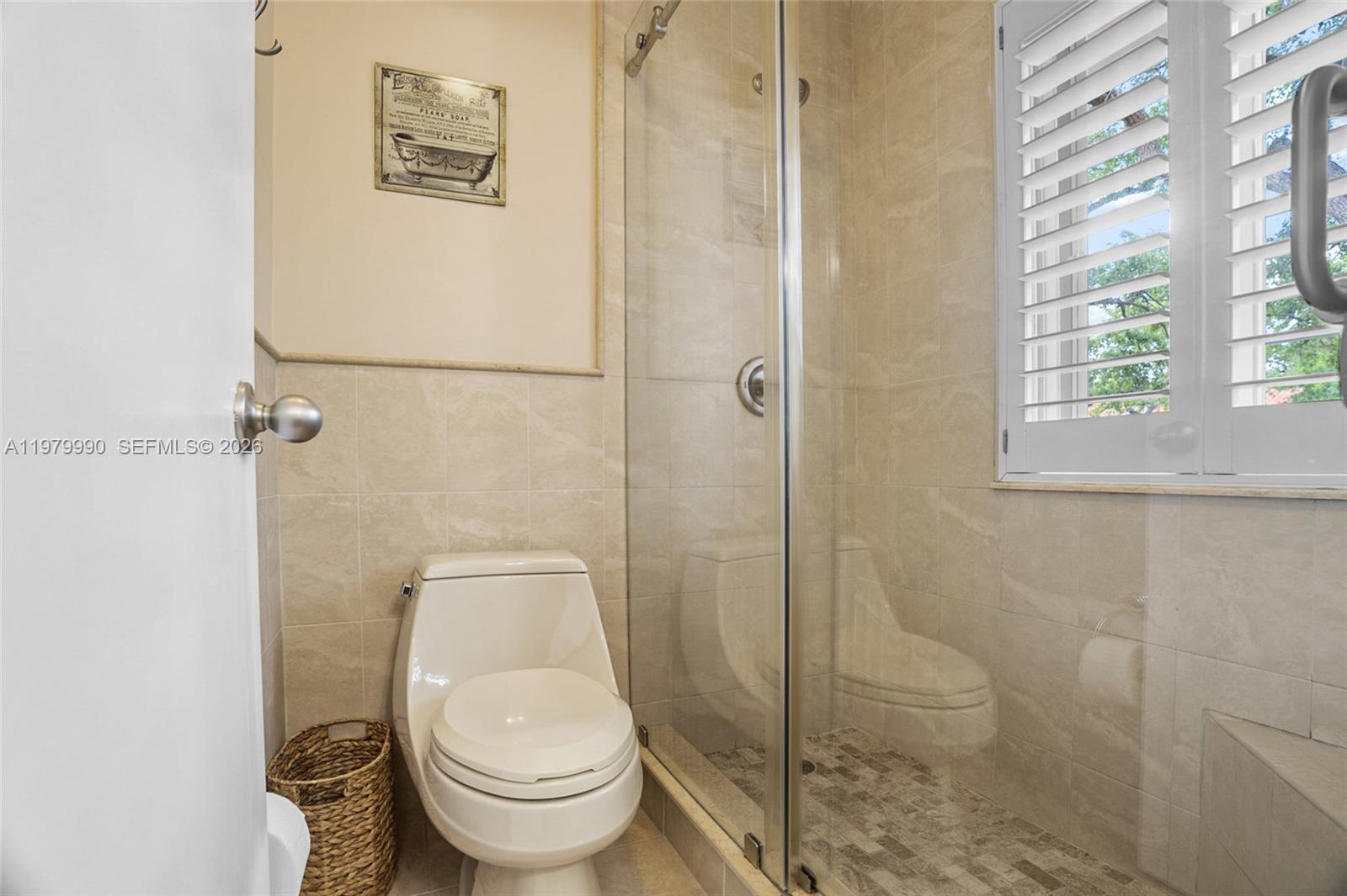 10978 Southwest 75th Terrace Miami, FL 33173 - Photo 14 of 34 a bathroom with a toilet and a shower