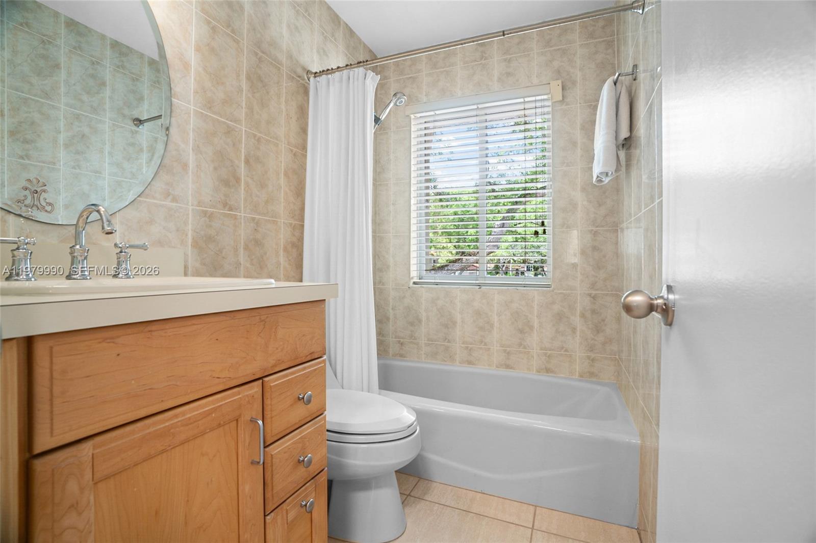 10978 Southwest 75th Terrace Miami, FL 33173 - Photo 16 of 34 a bathroom with a sink toilet and shower
