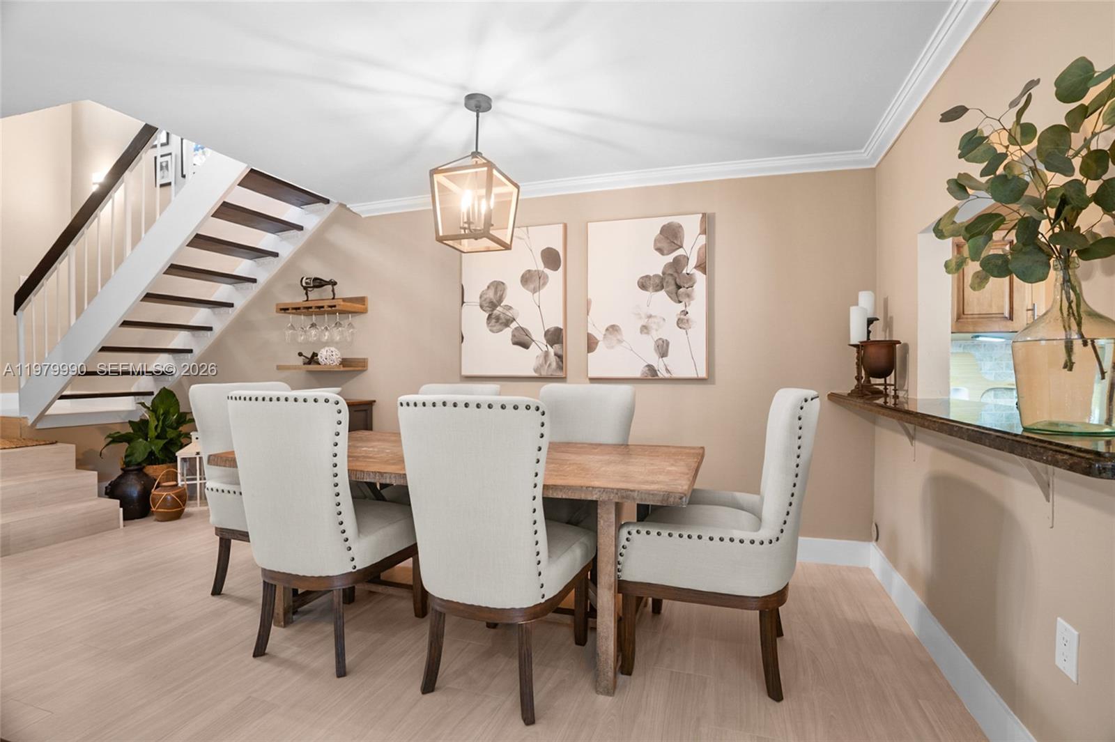 10978 Southwest 75th Terrace Miami, FL 33173 - Photo 4 of 34 a view of a dining room with furniture and wooden floor