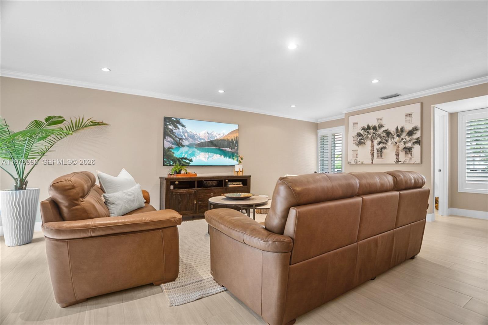 10978 Southwest 75th Terrace Miami, FL 33173 - Photo 8 of 34 a living room with furniture and a flat screen tv