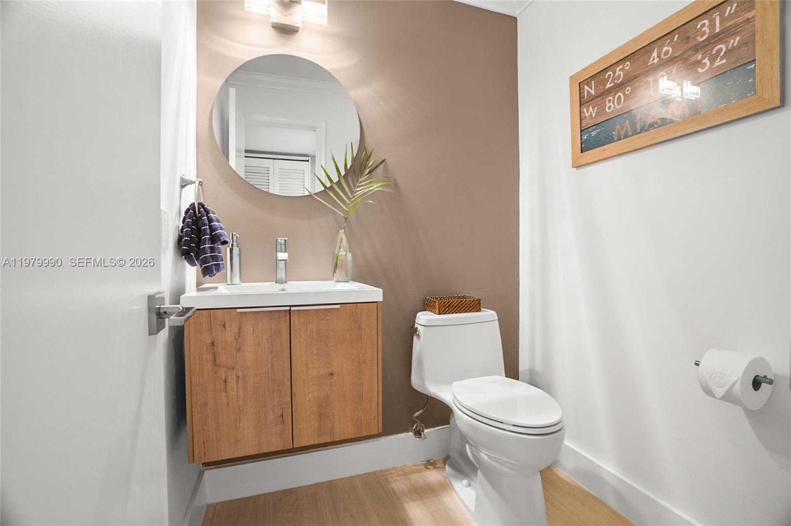 10978 Southwest 75th Terrace Miami, FL 33173 - Photo 9 of 34 a bathroom with a toilet a sink and mirror