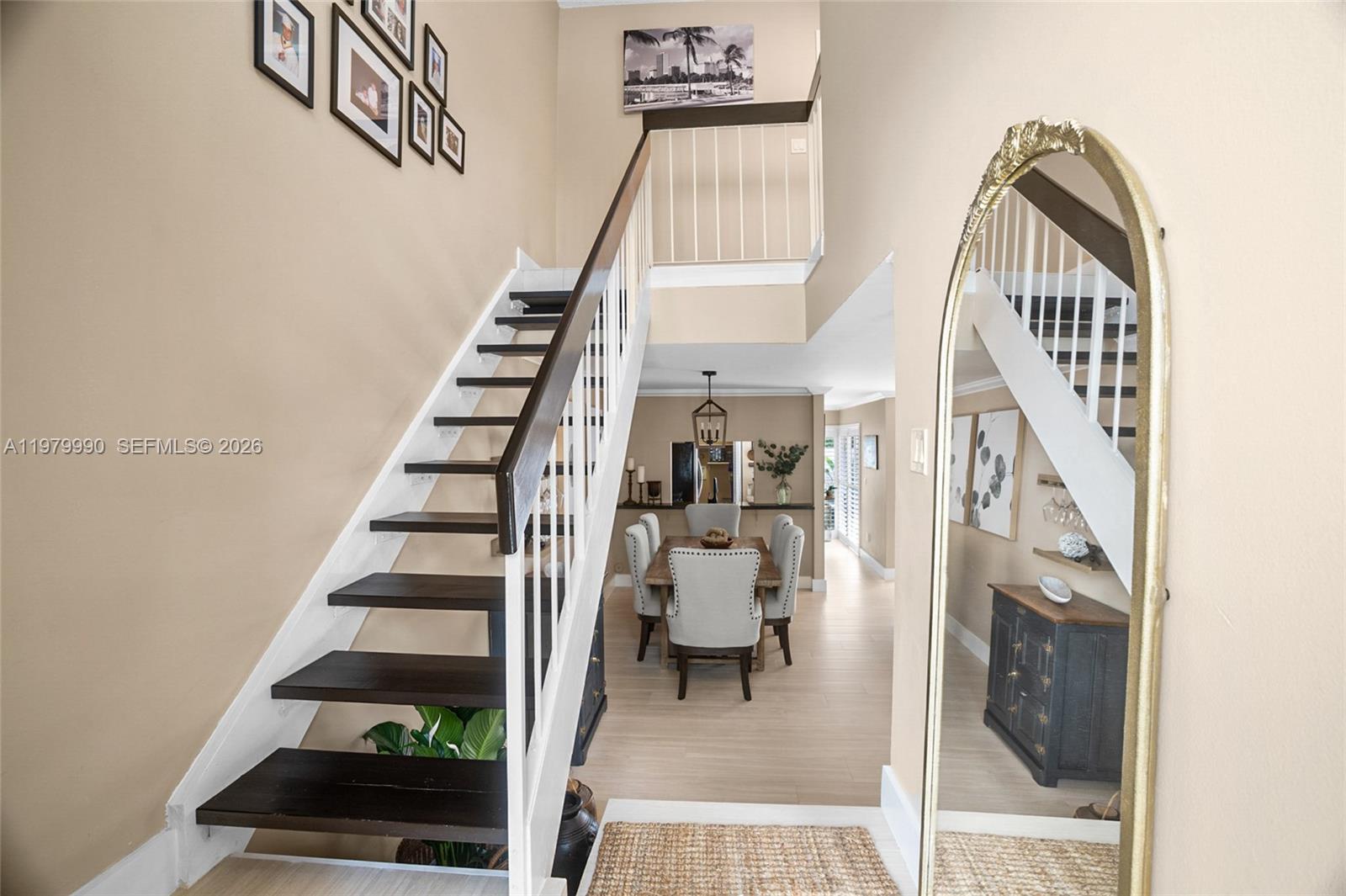 10978 Southwest 75th Terrace Miami, FL 33173 - Photo 10 of 34 a view of entryway with wooden floor and stairs