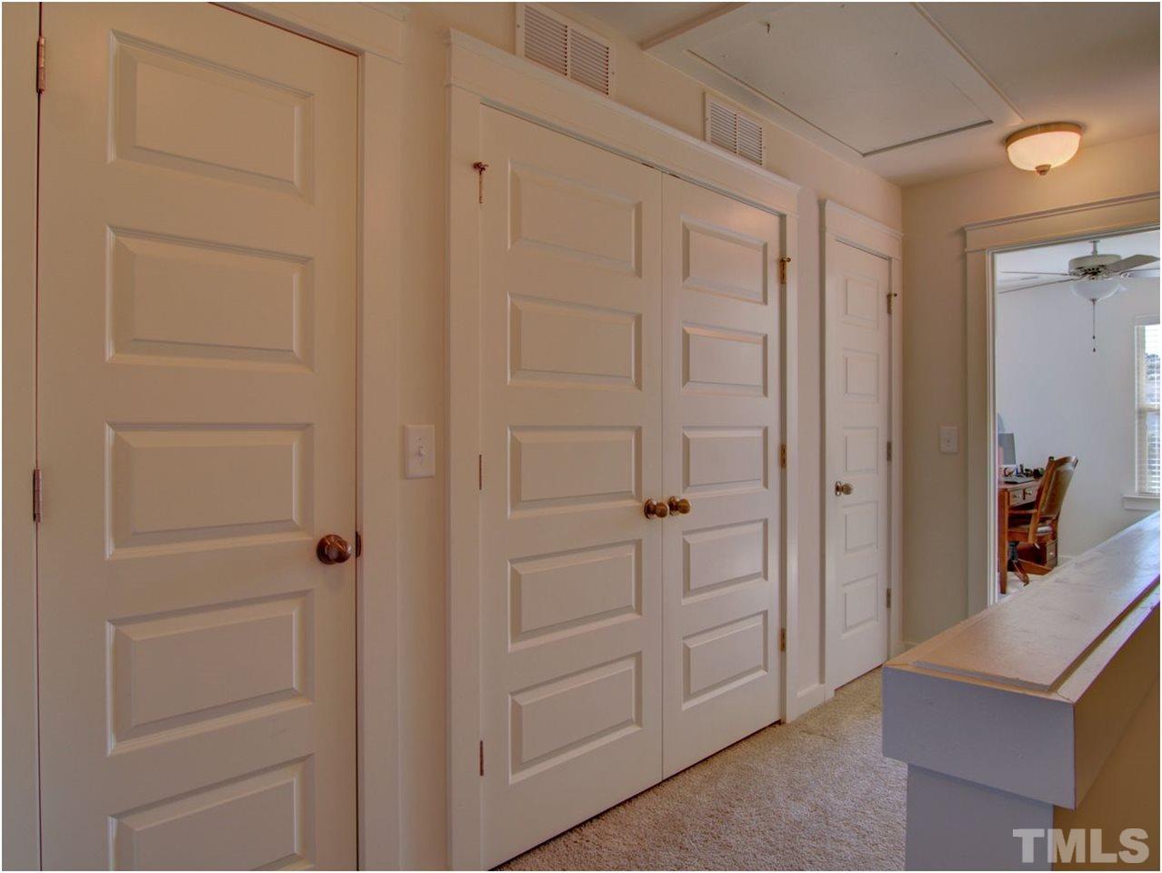 7902 Allscott Way Raleigh, NC 27612 - Photo 21 of 25 Two linen closets and a pull down attic mean STORAGE!