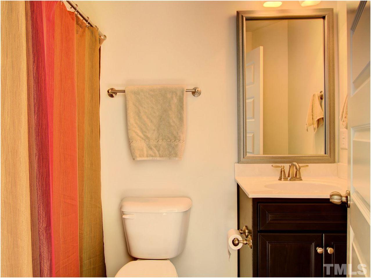 7902 Allscott Way Raleigh, NC 27612 - Photo 22 of 25 Guest bath with tile floor.