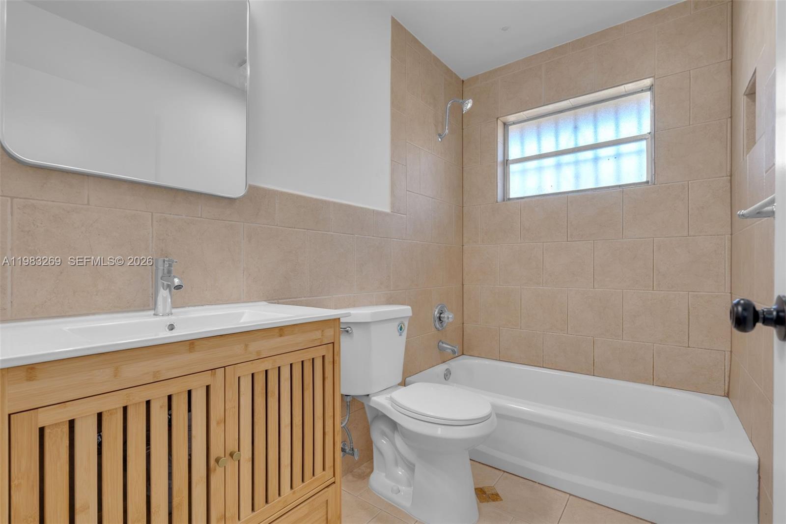 3572 Southwest 25th Street Miami, FL 33133 - Photo 13 of 18 a bathroom with a sink a toilet and bathtub