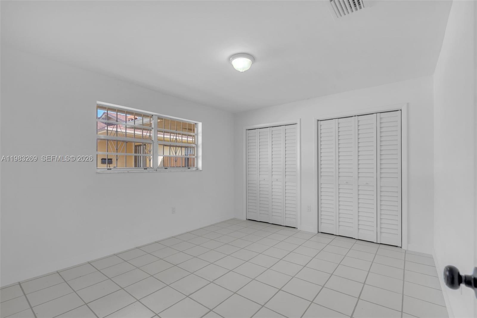 3572 Southwest 25th Street Miami, FL 33133 - Photo 14 of 18 a view of an empty room with window