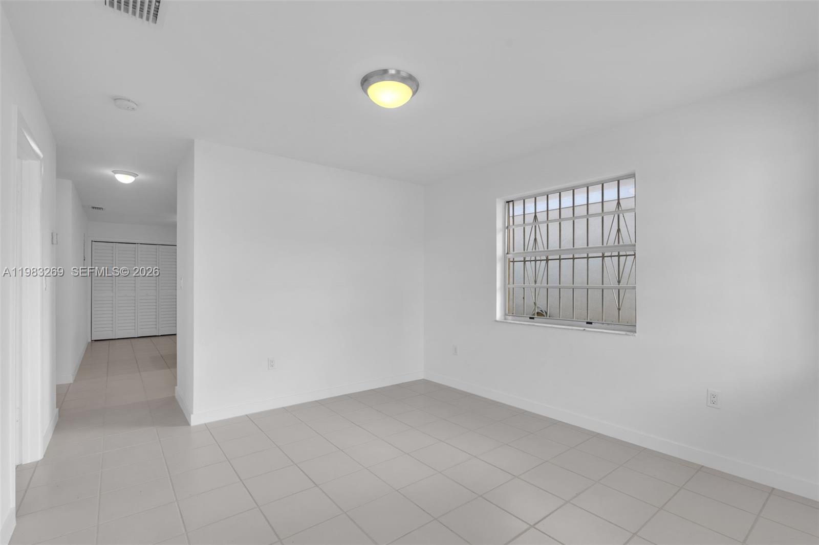 3572 Southwest 25th Street Miami, FL 33133 - Photo 3 of 18 an empty room with windows