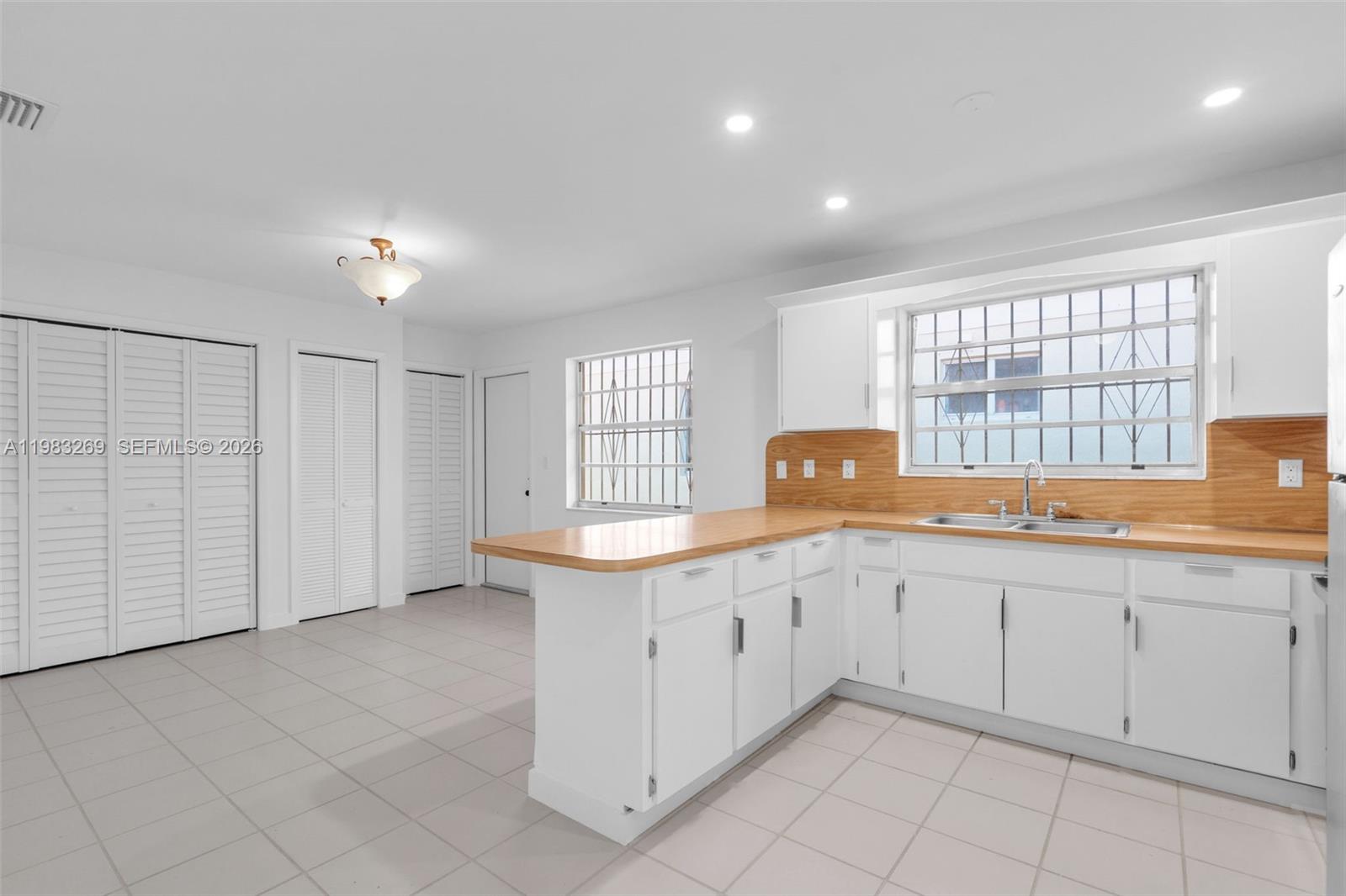 3572 Southwest 25th Street Miami, FL 33133 - Photo 6 of 18 a kitchen with a sink and cabinets