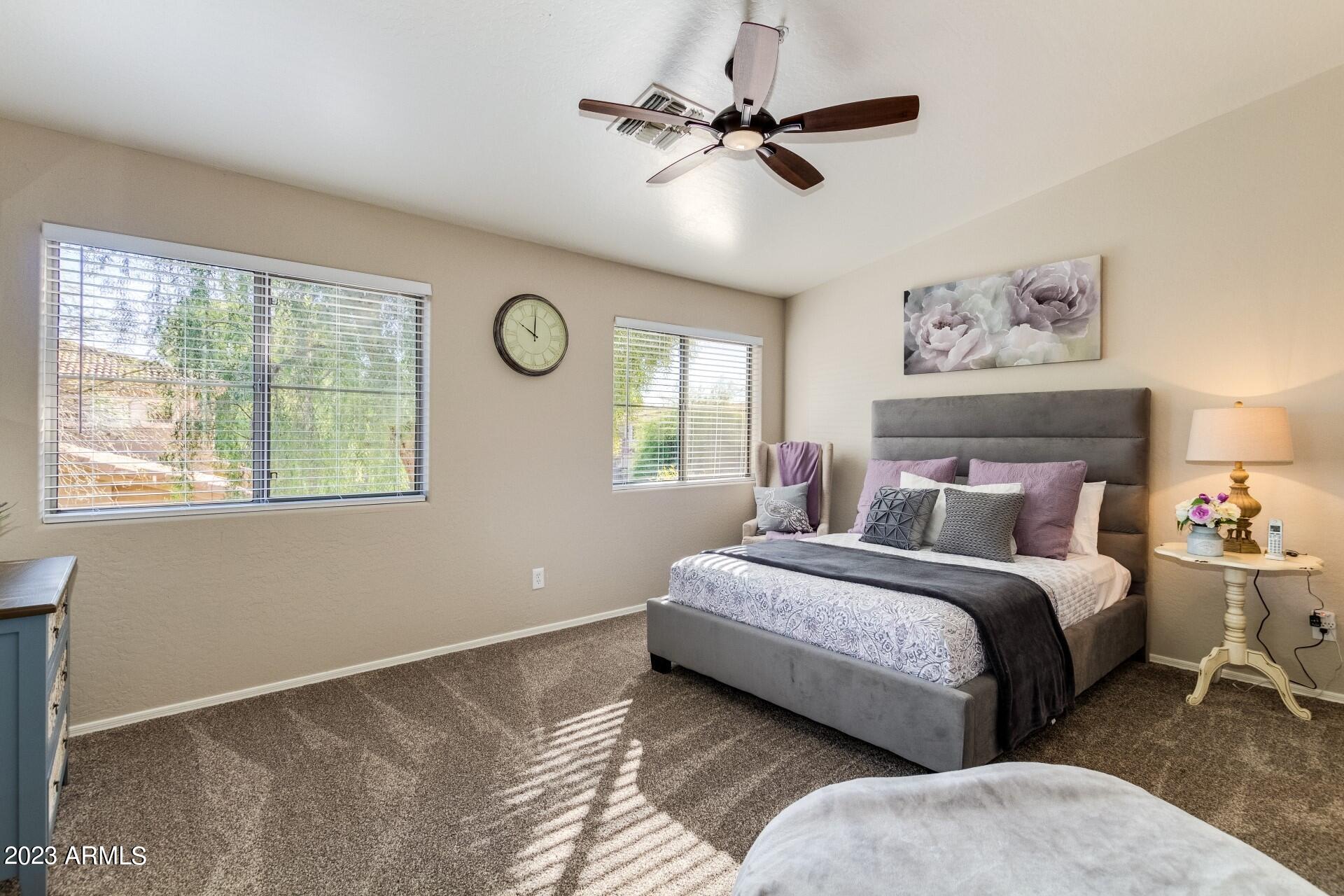 5415 East McKellips Road, Unit 94 Mesa, AZ 85215 - Photo 11 of 64 a spacious bedroom with a bed and a window