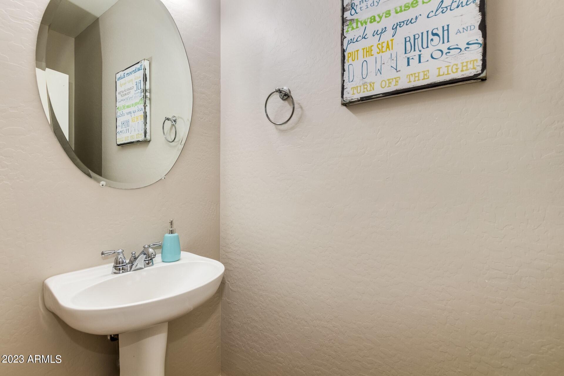 5415 East McKellips Road, Unit 94 Mesa, AZ 85215 - Photo 17 of 64 a bathroom with a sink and mirror
