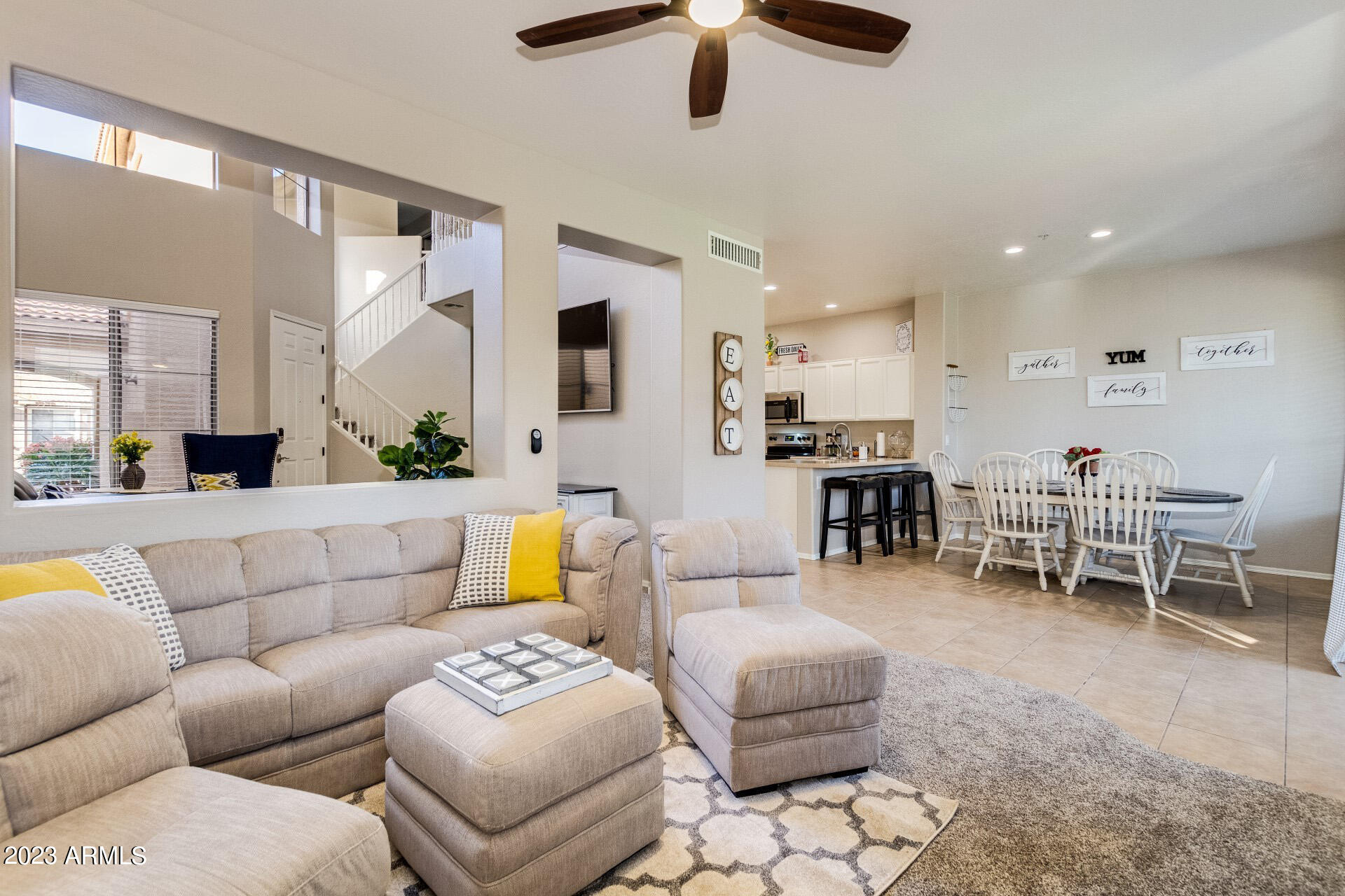 5415 East McKellips Road, Unit 94 Mesa, AZ 85215 - Photo 20 of 64 a living room with furniture and a large window