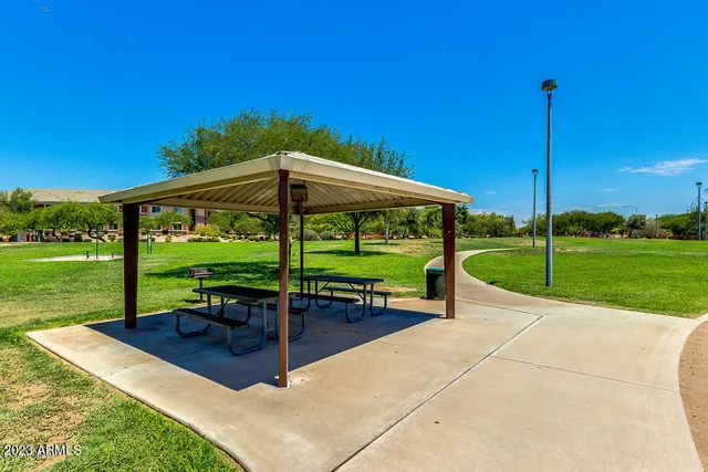 a view of a park with chairs