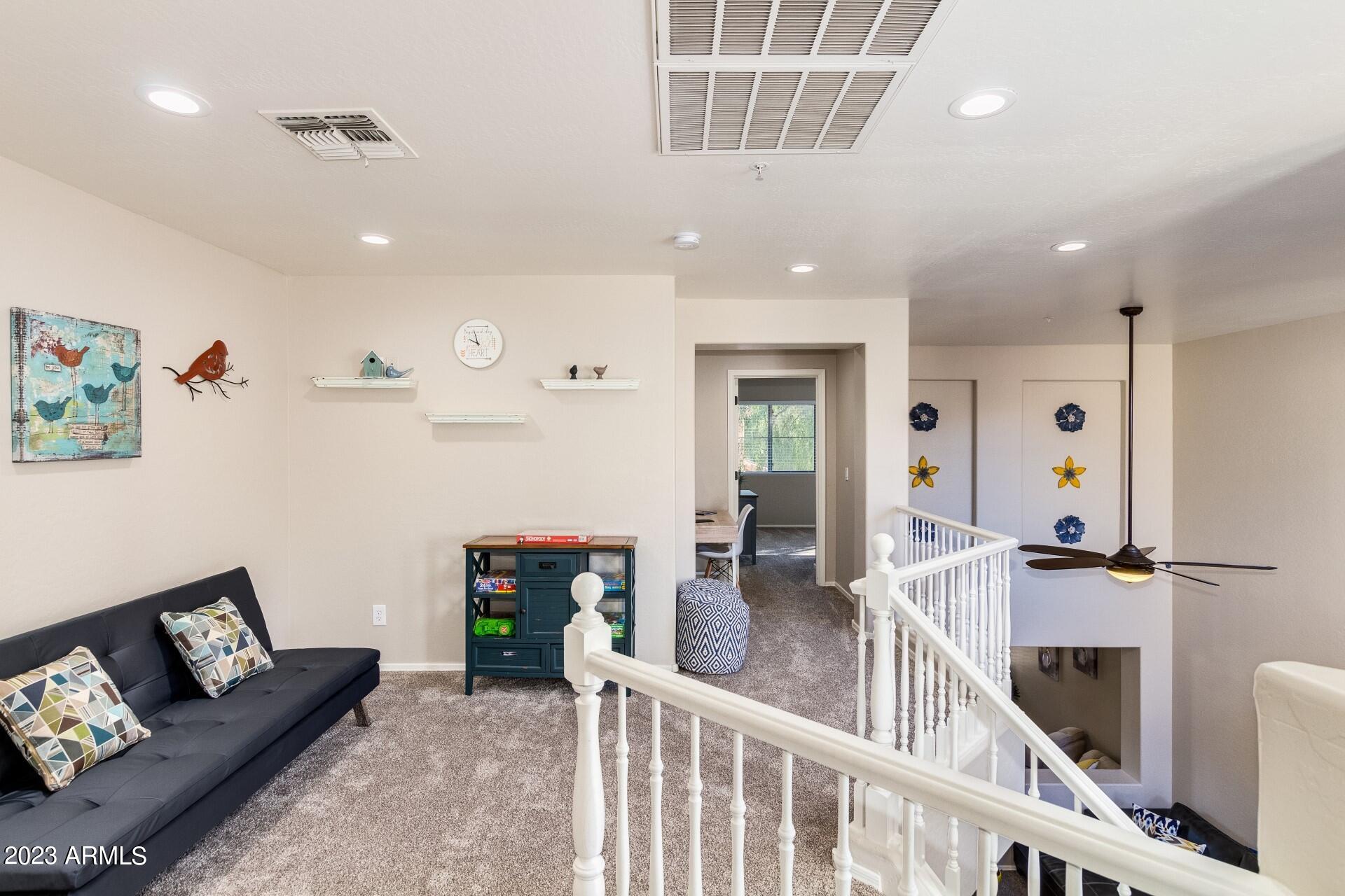 5415 East McKellips Road, Unit 94 Mesa, AZ 85215 - Photo 9 of 64 a living room with furniture and a wooden floor