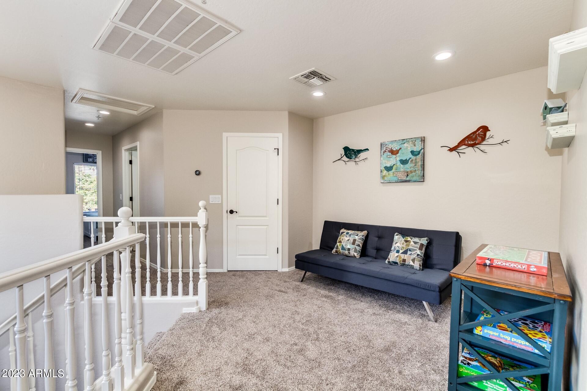 5415 East McKellips Road, Unit 94 Mesa, AZ 85215 - Photo 10 of 64 a living room with furniture and a wooden floor