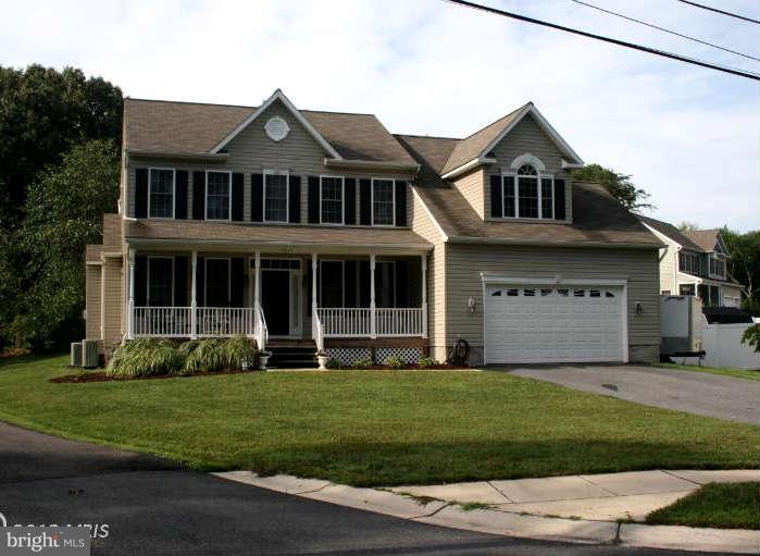 4027 Brummel Road Pasadena, MD 21122 - Photo 2 of 25 a front view of a house with a yard