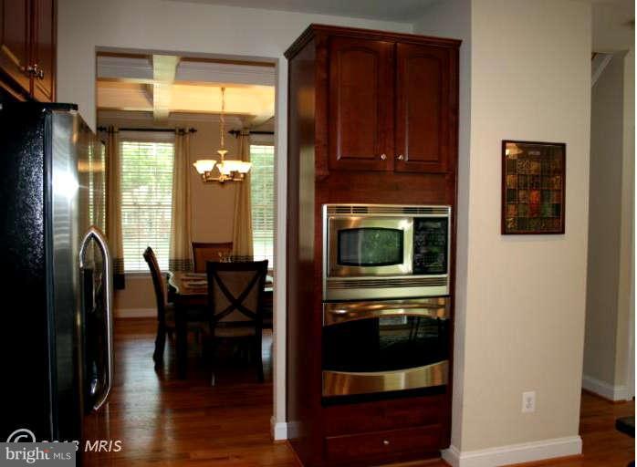 4027 Brummel Road Pasadena, MD 21122 - Photo 12 of 25 a kitchen with stainless steel appliances granite countertop a refrigerator and a stove top oven