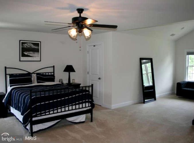 4027 Brummel Road Pasadena, MD 21122 - Photo 16 of 25 a bedroom with bed and window
