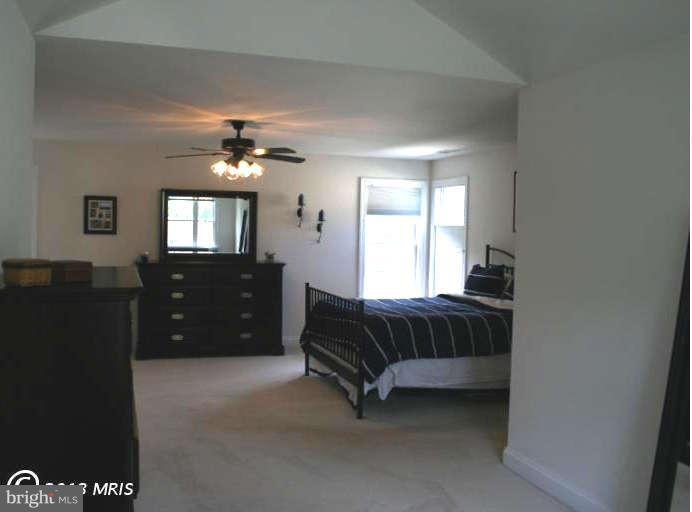 4027 Brummel Road Pasadena, MD 21122 - Photo 17 of 25 a bedroom with a bed and a dresser