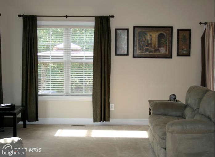 4027 Brummel Road Pasadena, MD 21122 - Photo 5 of 25 a living room with furniture and a window