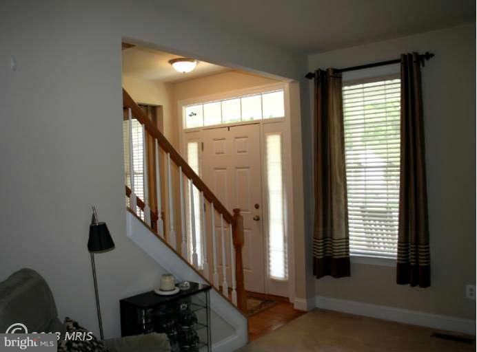 4027 Brummel Road Pasadena, MD 21122 - Photo 6 of 25 a view of an entryway with staircase