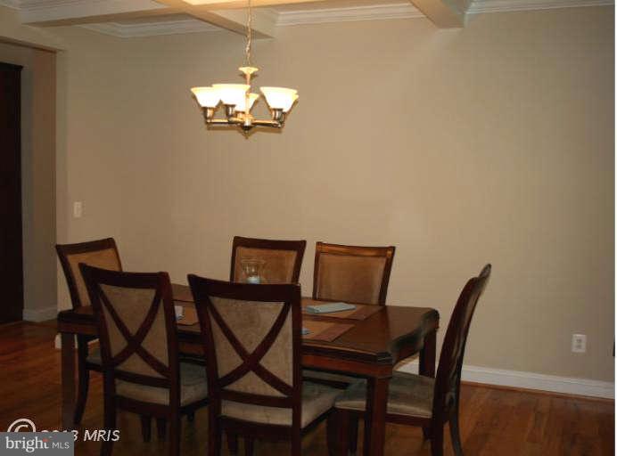 4027 Brummel Road Pasadena, MD 21122 - Photo 7 of 25 a view of a dining room with furniture and a chandelier