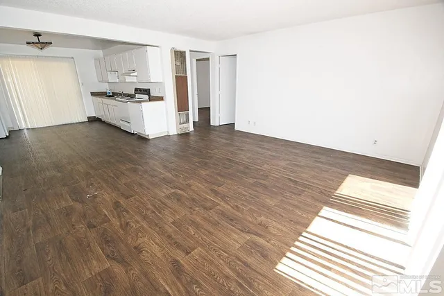 a view of kitchen with sink and cabinets
