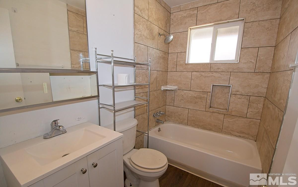 1131 Parkview Street Reno, NV 89502 - Photo 6 of 6 a bathroom with a sink a toilet and shower