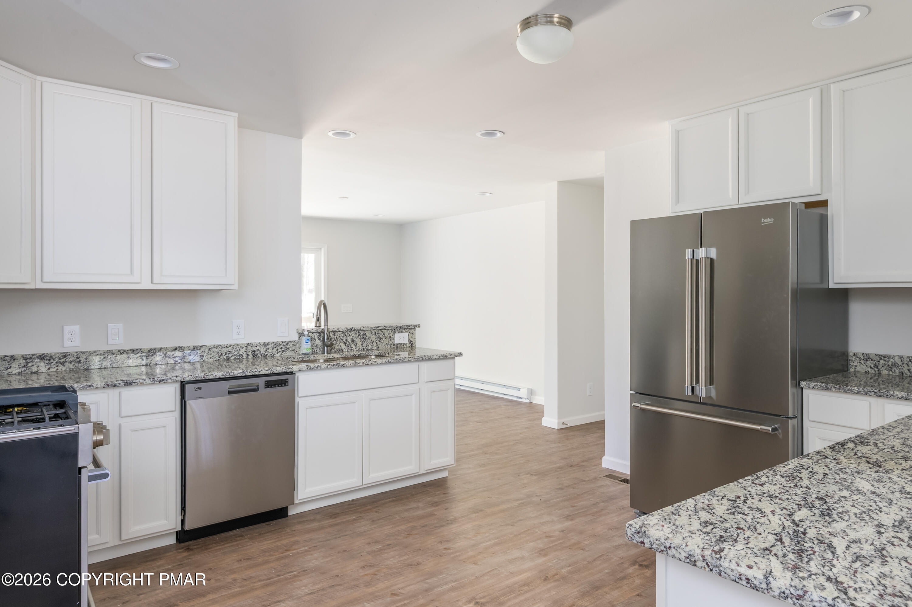 456 Big Oak Road Canadensis, PA 18325 - Photo 8 of 20 a kitchen with stainless steel appliances granite countertop a refrigerator and a stove