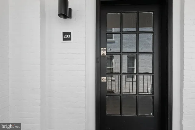 a picture of a bench in front of a door