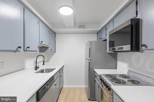 a kitchen with a stove and a microwave