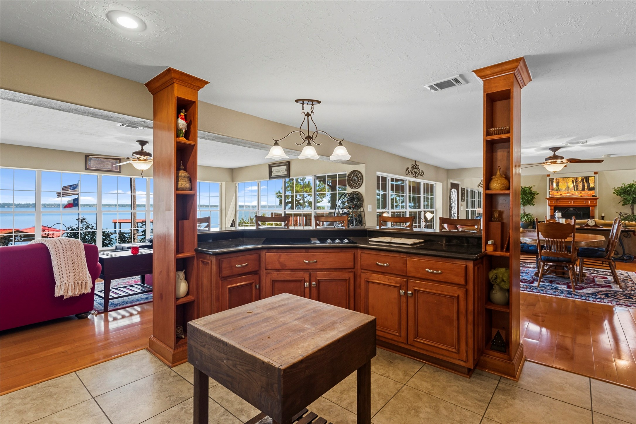 200 Trott Lane Point Blank, TX 77364 - Photo 15 of 50 a kitchen with stainless steel appliances granite countertop table chairs sink and cabinets