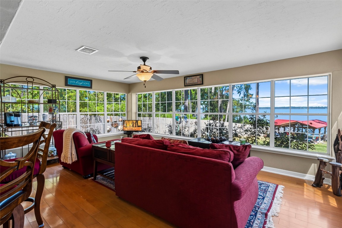 200 Trott Lane Point Blank, TX 77364 - Photo 17 of 50 a living room with furniture and a floor to ceiling window