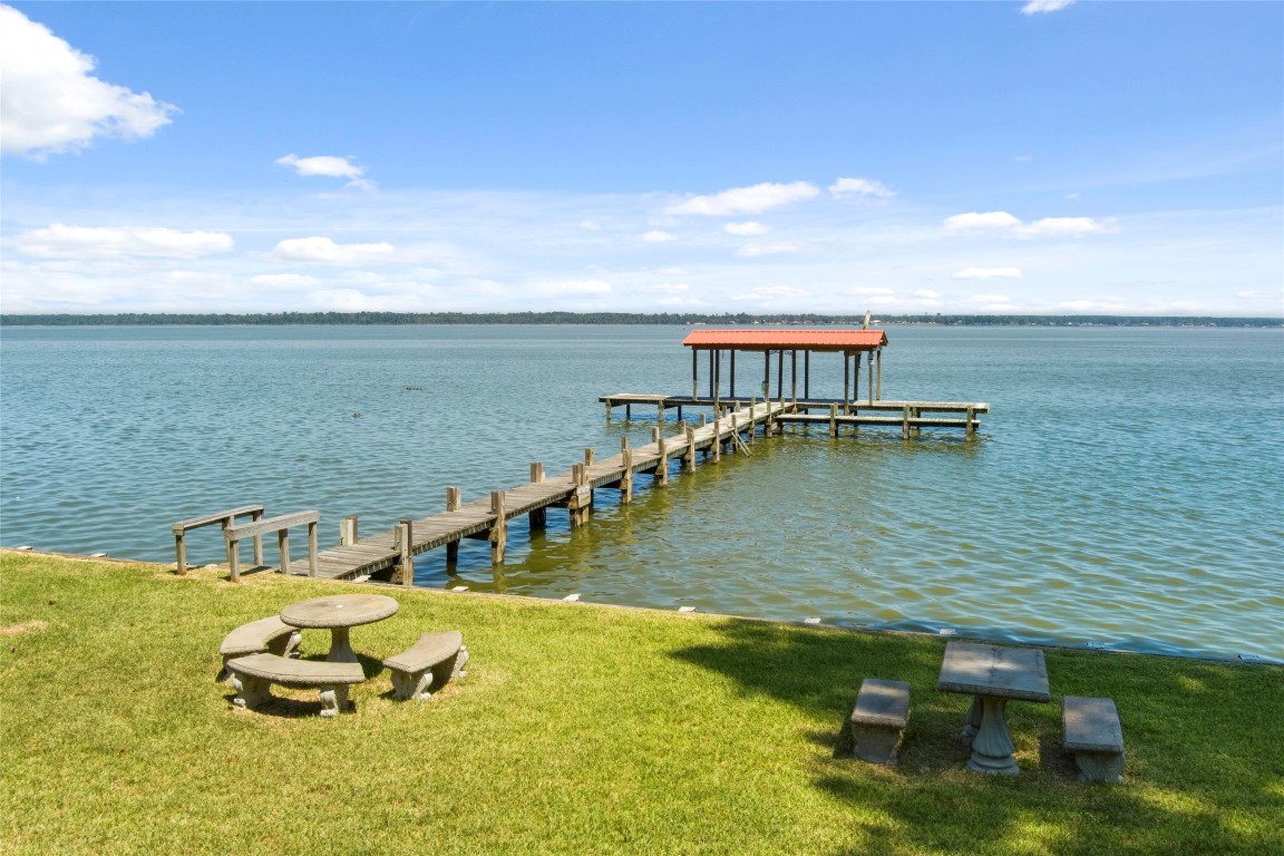 200 Trott Lane Point Blank, TX 77364 - Photo 2 of 50 a view of a lake with a car parked