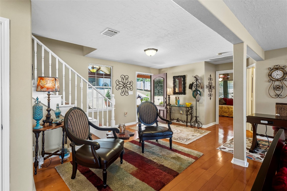 200 Trott Lane Point Blank, TX 77364 - Photo 8 of 50 a living room with furniture and a floor to ceiling window