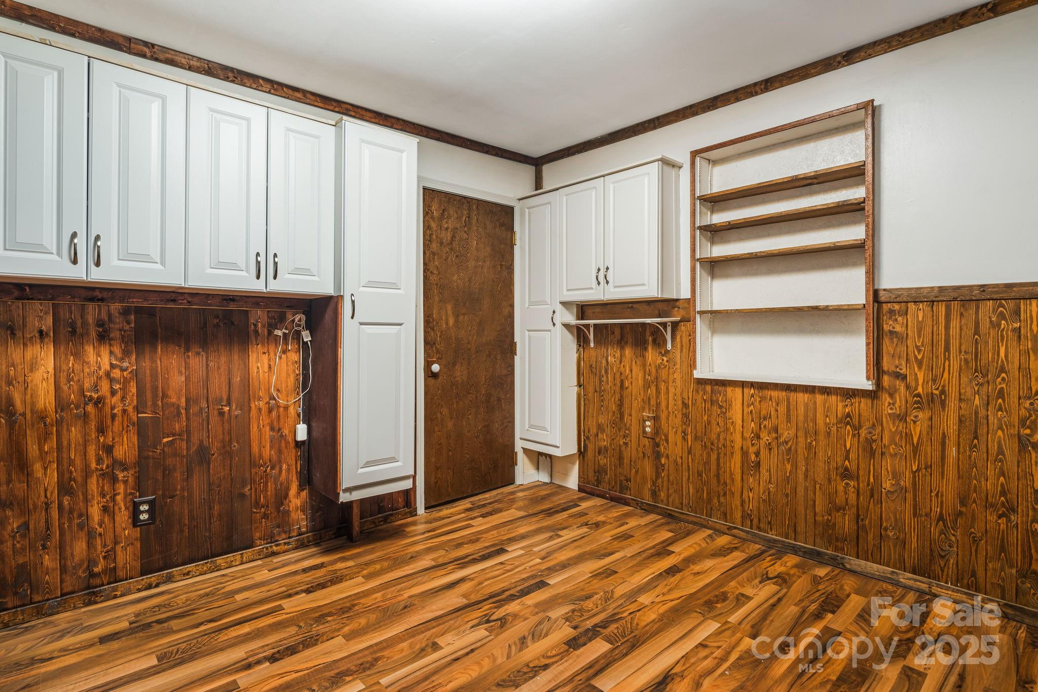 814 Little Creek Road Burnsville, NC 28714 - Photo 18 of 32 a view of a room with wooden floor and cabinet