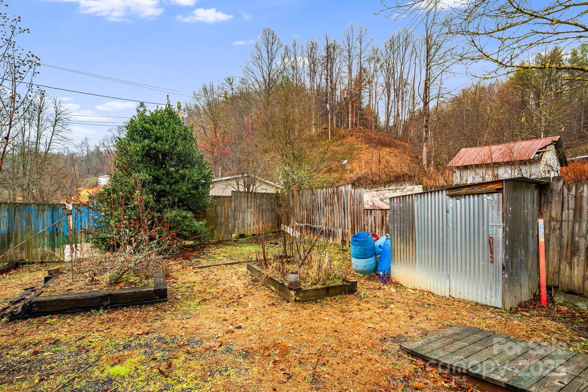 814 Little Creek Road Burnsville, NC 28714 - Photo 22 of 32 a view of parking area of a house