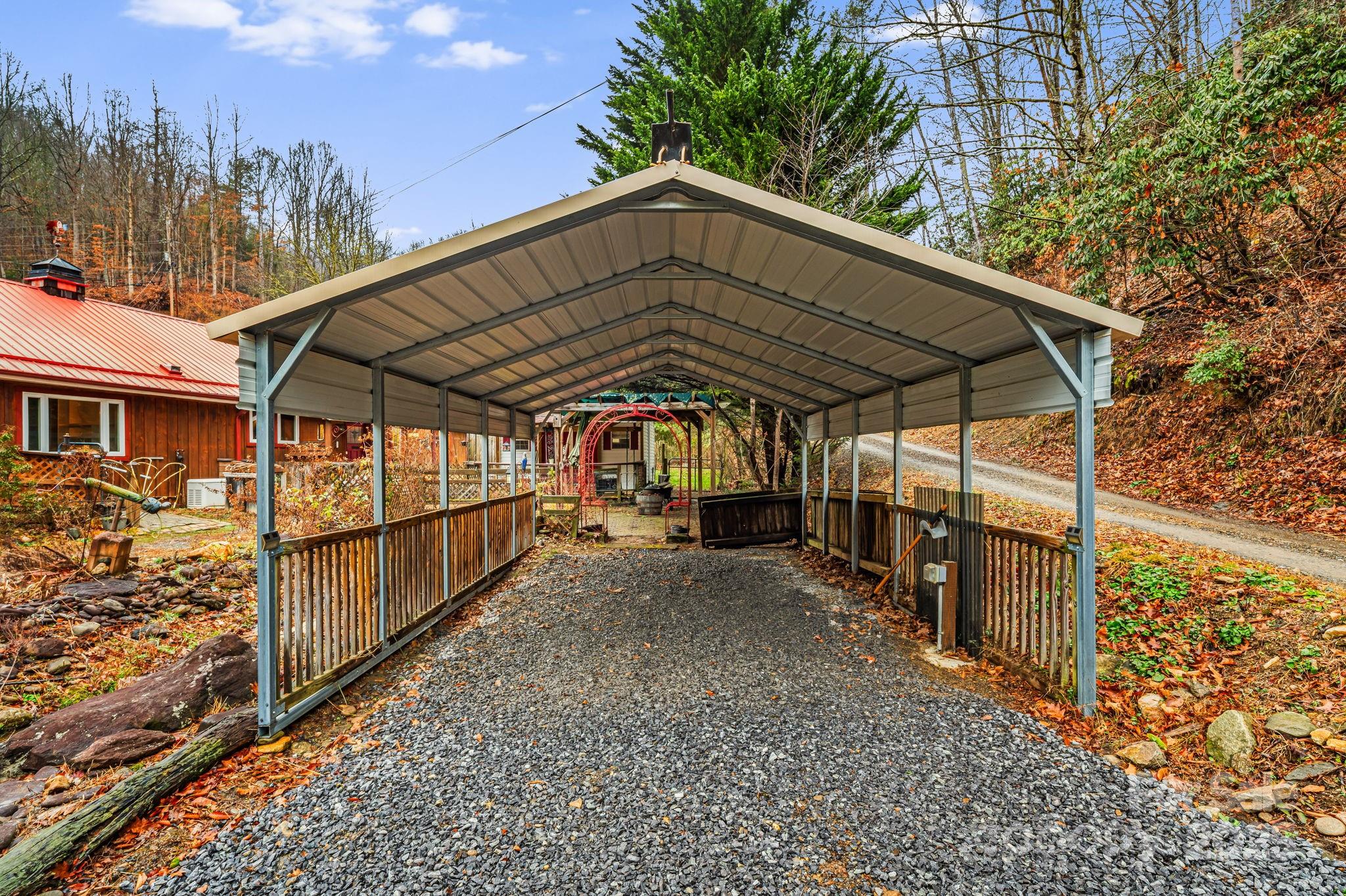 814 Little Creek Road Burnsville, NC 28714 - Photo 29 of 32 a view of a porch with a yard