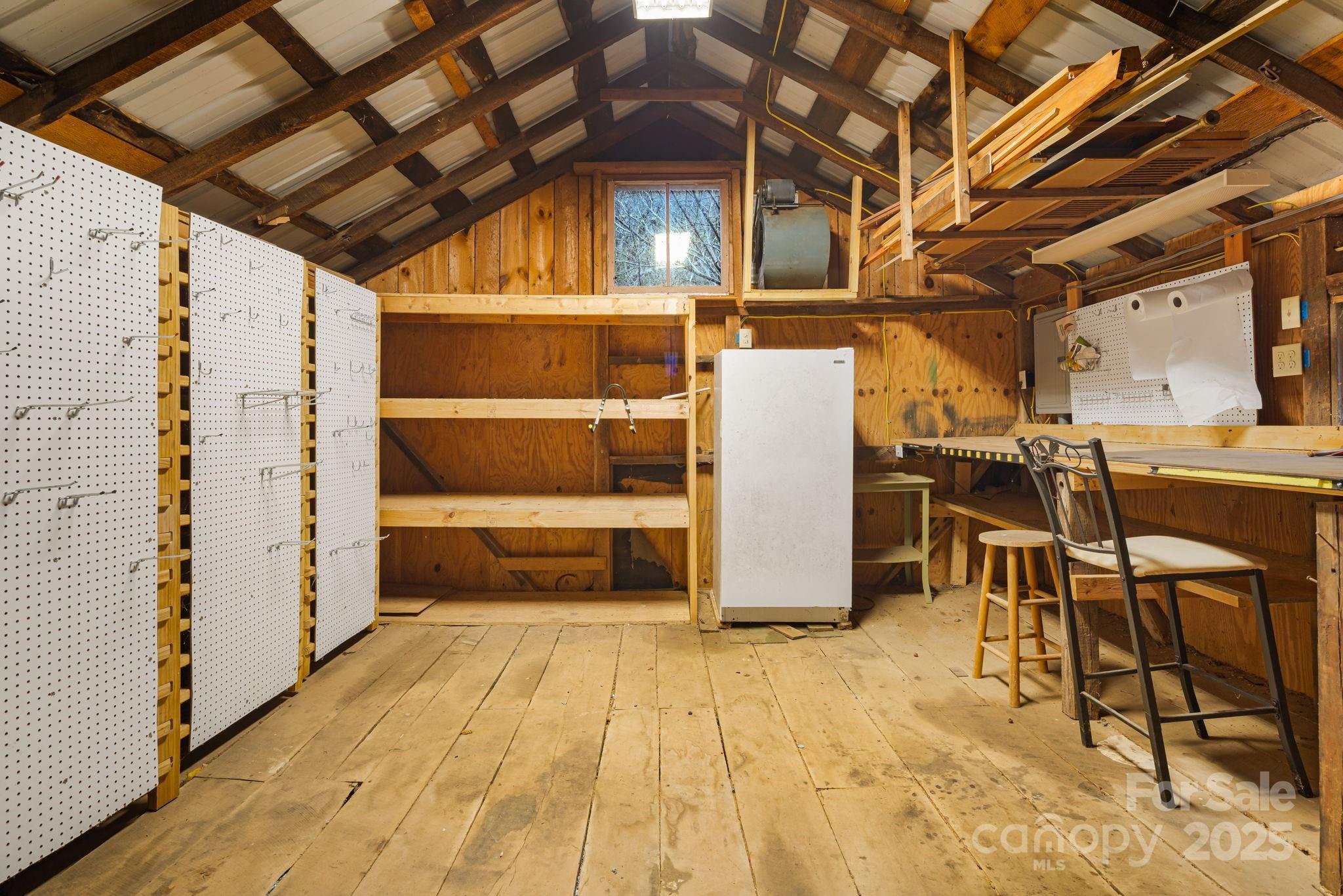 814 Little Creek Road Burnsville, NC 28714 - Photo 30 of 32 a view of a room with wooden walls