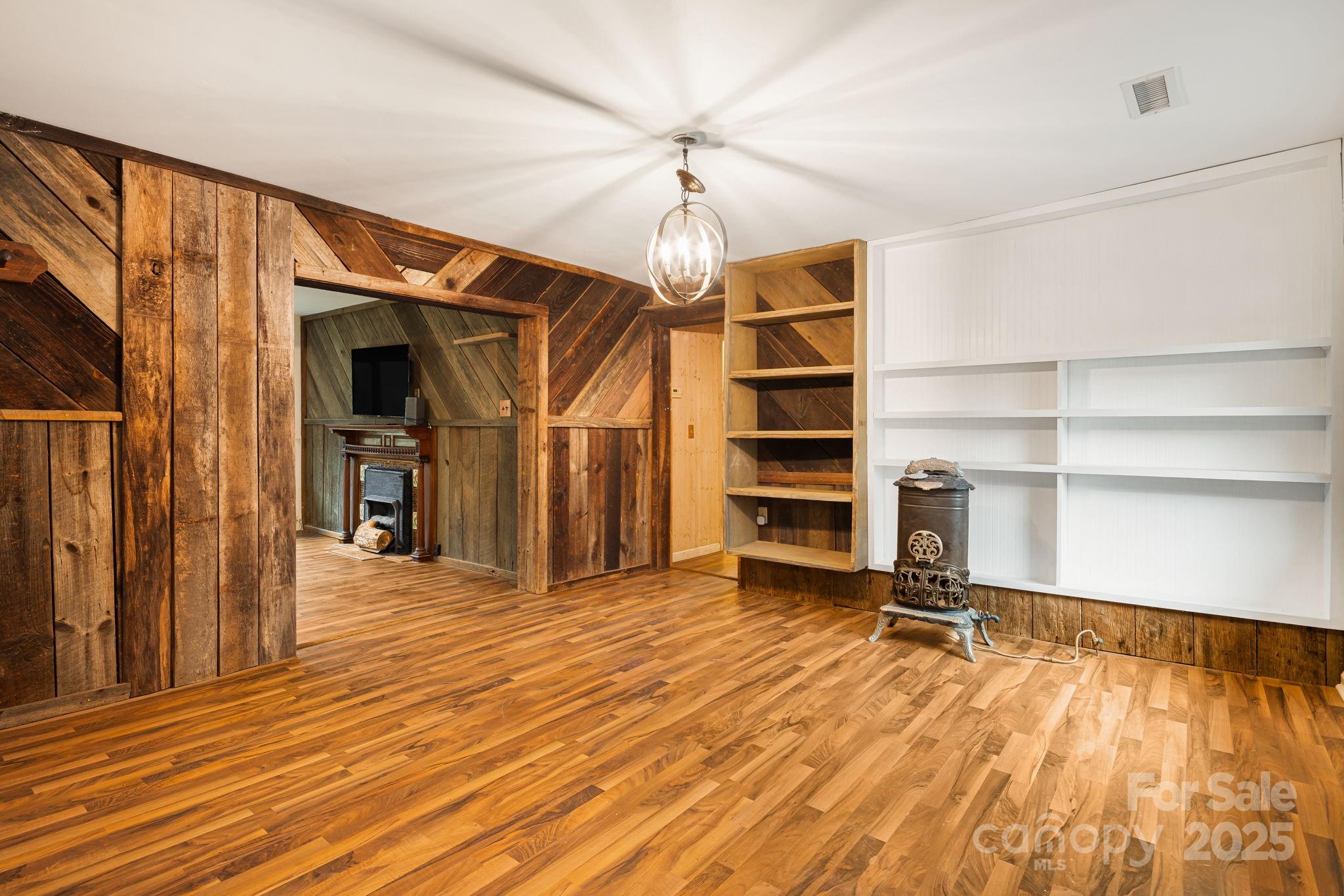 814 Little Creek Road Burnsville, NC 28714 - Photo 4 of 32 a view of a livingroom with a staircase