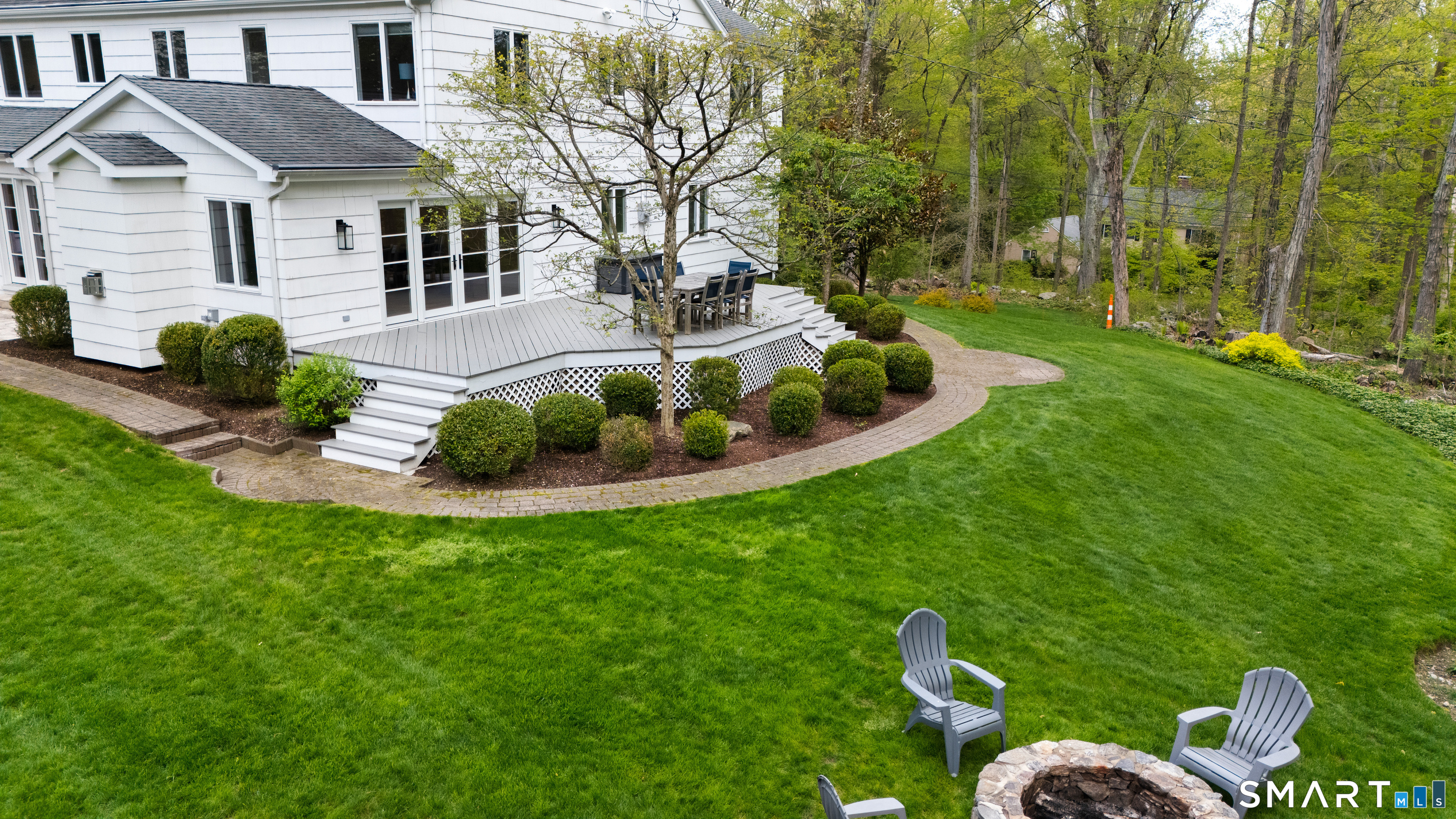 23 Norton Road Easton, CT 06612 - Photo 34 of 40 The deck off the family room overlooking the outdoor landscape.