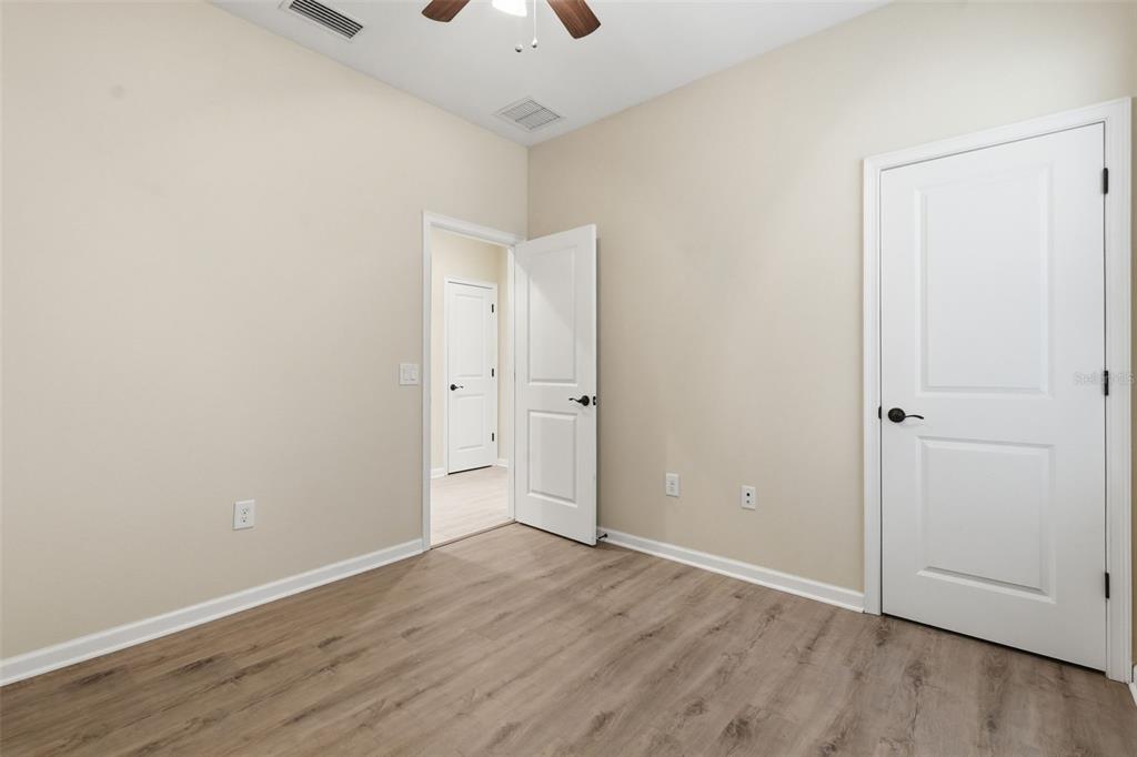29241 Perilli Place Wesley Chapel, FL 33543 - Photo 30 of 53 an empty room with wooden floor