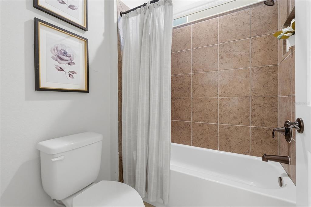 29241 Perilli Place Wesley Chapel, FL 33543 - Photo 32 of 53 a white toilet sitting next to a bath tub